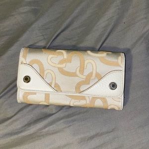 Tan heart wallet. Maybe used once or twice